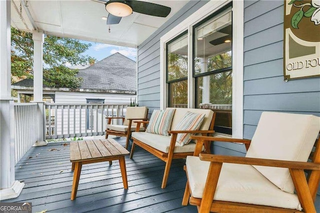 deck featuring ceiling fan and an outdoor hangout area