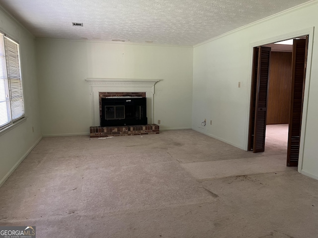 106 Country Club Rd, Dublin, GA 31021 - unfurnished living room featuring a fireplace, a textured ceiling, carpet flooring, and ornamental molding