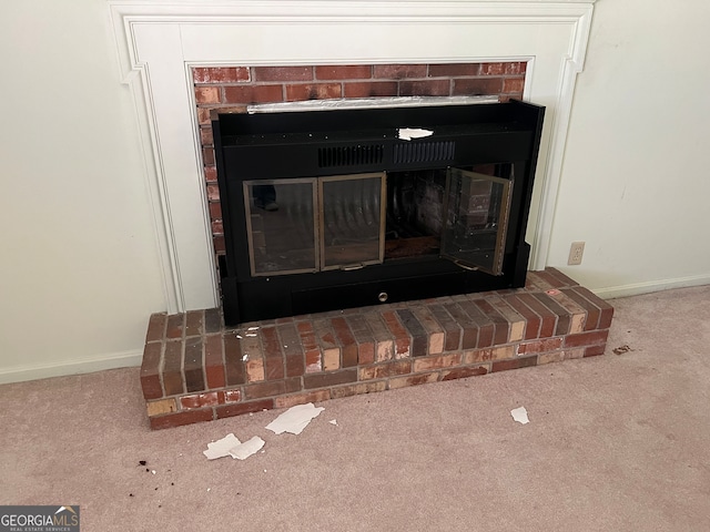 interior details with carpet flooring and a fireplace