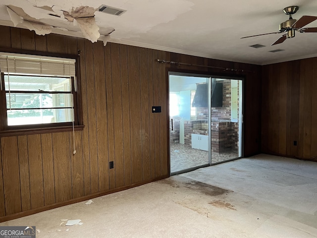 106 Country Club Rd, Dublin, GA 31021 - carpeted empty room featuring wood walls and ceiling fan