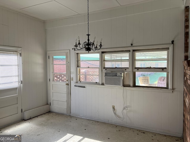 106 Country Club Rd, Dublin, GA 31021 - unfurnished dining area featuring a chandelier, cooling unit, and wooden walls