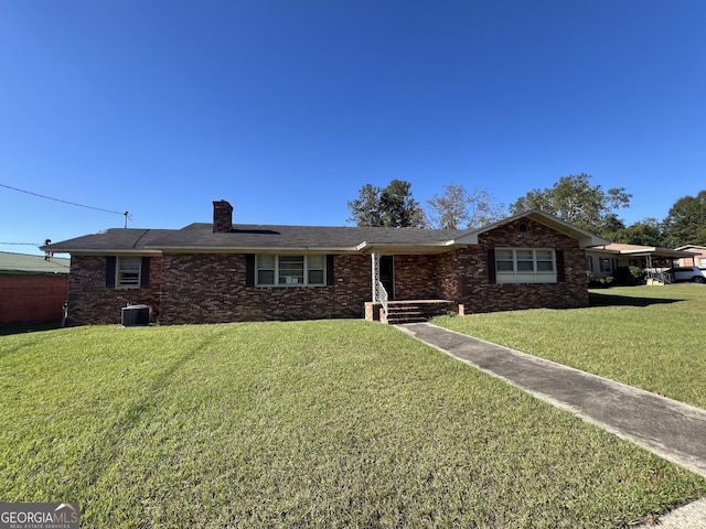 106 Country Club Rd, Dublin, GA 31021 - single story home featuring a front yard, a chimney, and brick siding