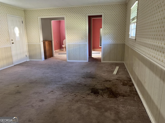 106 Country Club Rd, Dublin, GA 31021 - carpeted spare room with a wainscoted wall, ornamental molding, and wallpapered walls