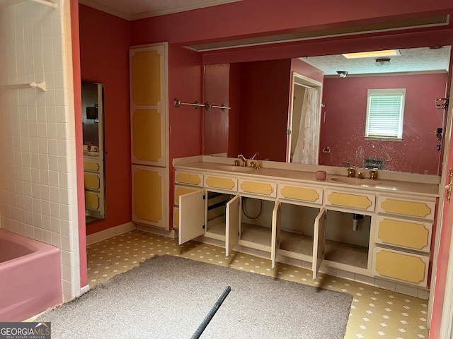 bathroom with vanity and a bath