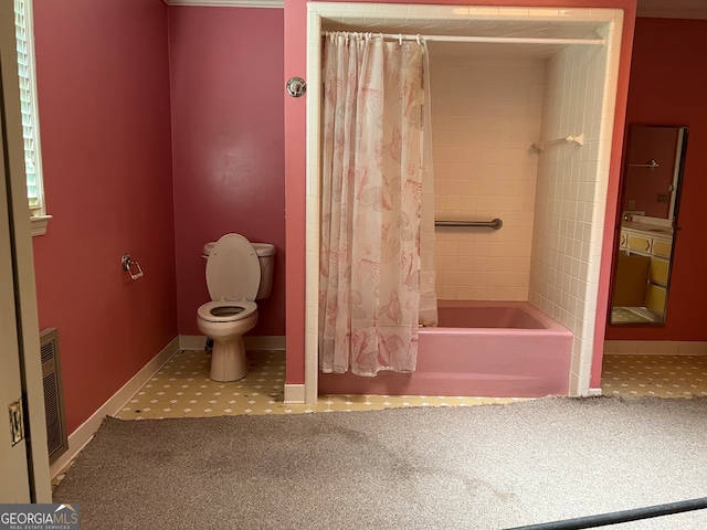 bathroom featuring heating unit, toilet, and shower / bath combo with shower curtain