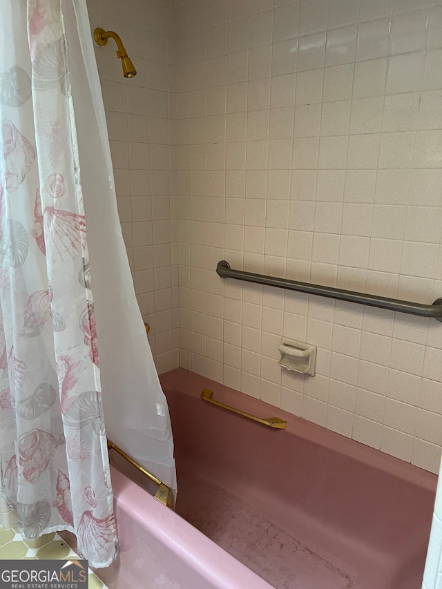 bathroom with shower / bathtub combination with curtain