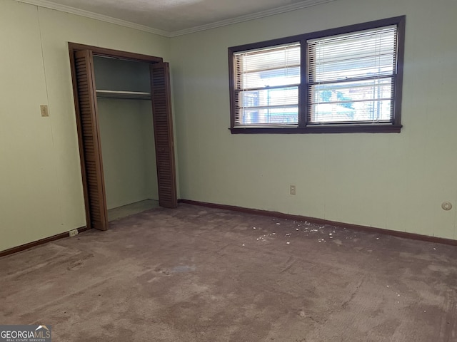 106 Country Club Rd, Dublin, GA 31021 - unfurnished bedroom with ornamental molding, carpet floors, and a closet