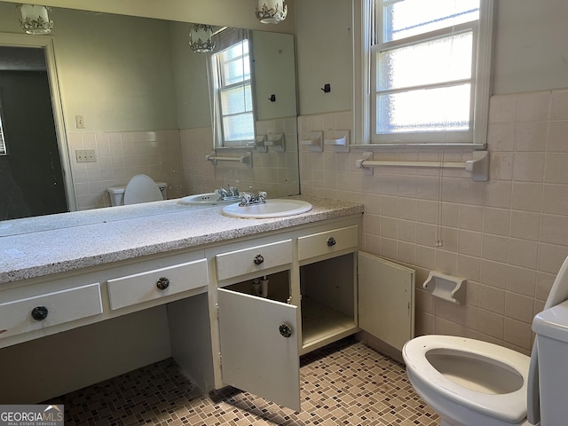 106 Country Club Rd, Dublin, GA 31021 - bathroom with tile walls, a wainscoted wall, vanity, and tile patterned floors