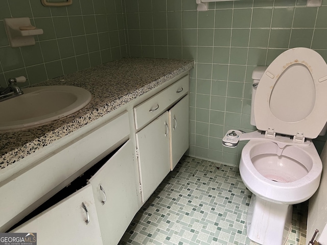 106 Country Club Rd, Dublin, GA 31021 - bathroom with tile walls, vanity, and tile patterned floors