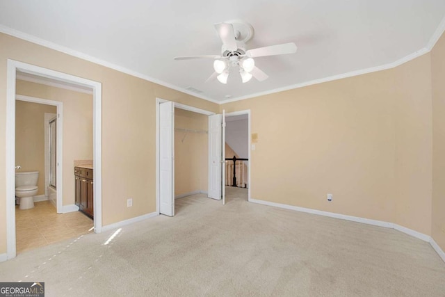 unfurnished bedroom featuring light colored carpet, a closet, crown molding, and ceiling fan