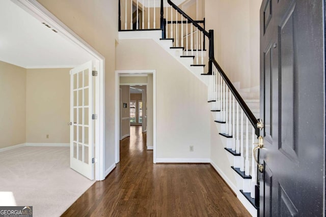 foyer entrance featuring dark hardwood / wood-style floors