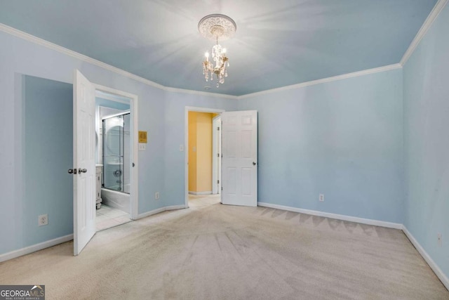 carpeted spare room with crown molding and a notable chandelier