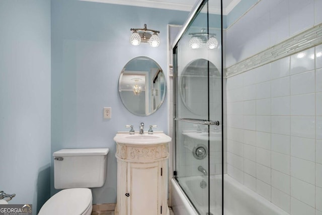 full bathroom with toilet, combined bath / shower with glass door, ornamental molding, and vanity