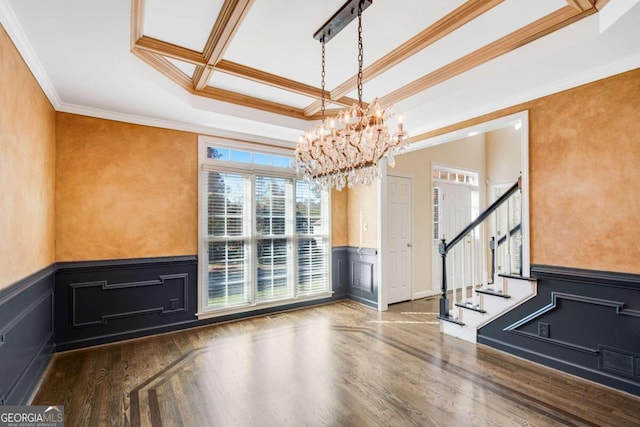 interior space featuring a notable chandelier, dark hardwood / wood-style flooring, and crown molding