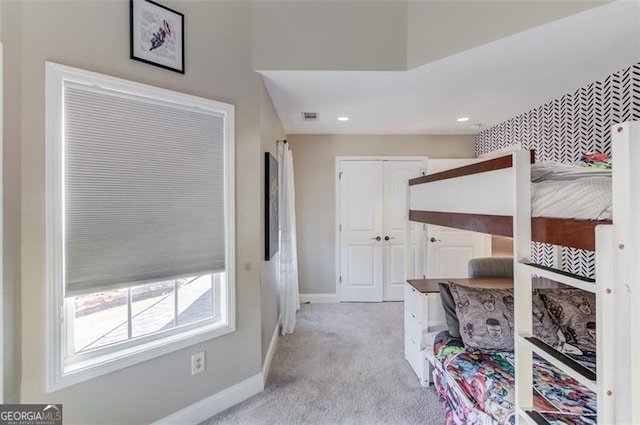 bedroom with light carpet