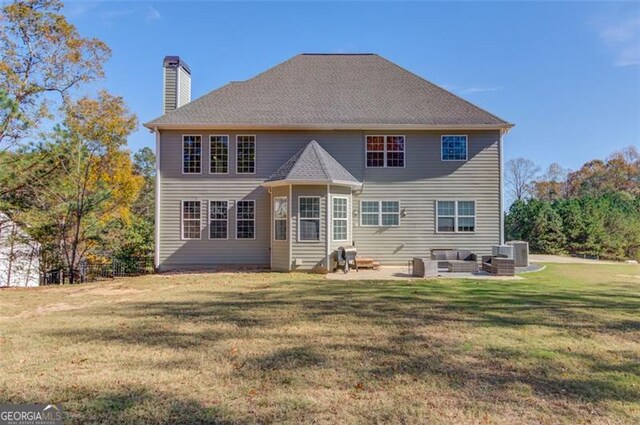 rear view of house with a lawn, a patio, and central AC unit