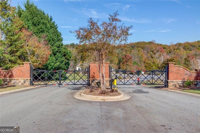 view of gate with a mountain view