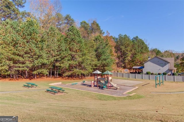 view of jungle gym with a lawn