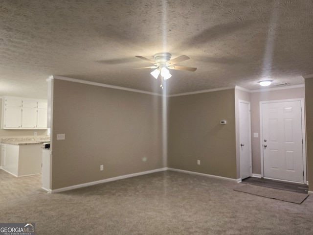 unfurnished living room featuring ceiling fan, crown molding, and a textured ceiling