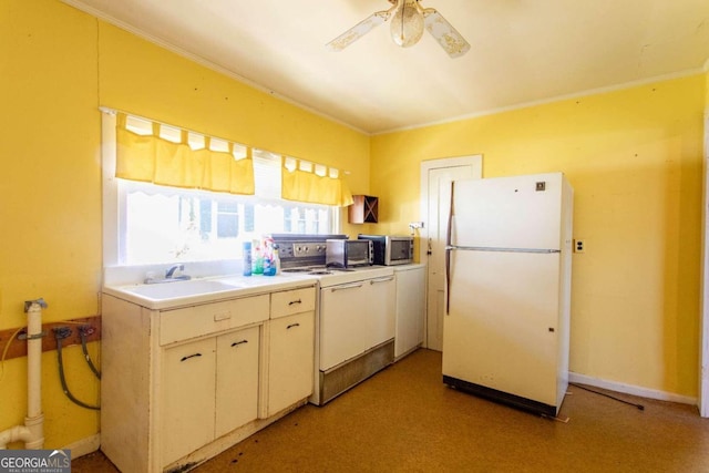 kitchen with white appliances, ceiling fan, crown molding, sink, and washer / clothes dryer