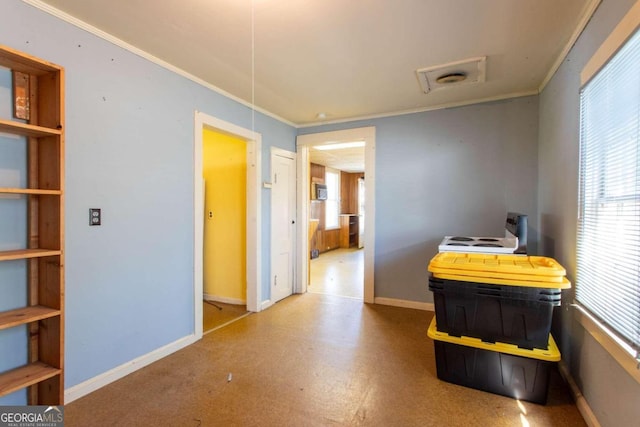 miscellaneous room with ornamental molding