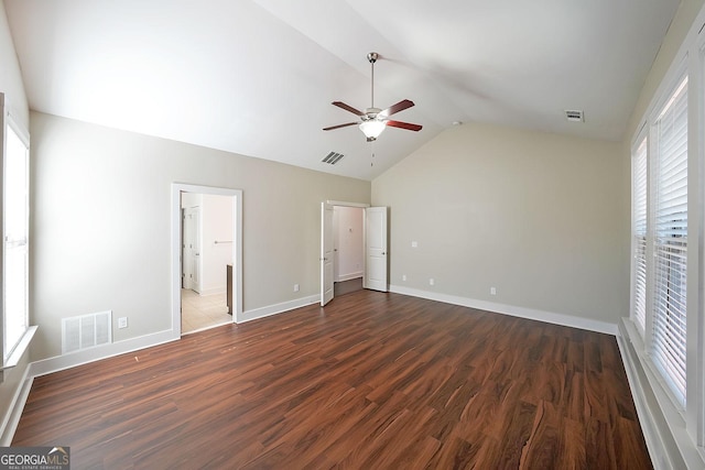 unfurnished bedroom with multiple windows, dark hardwood / wood-style floors, and ceiling fan