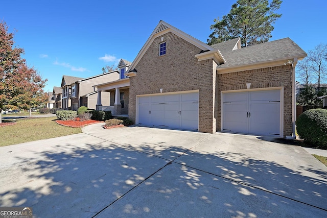 exterior space featuring a garage and a front lawn