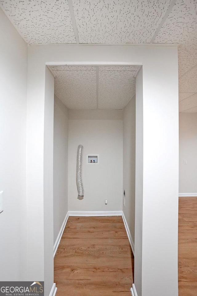 washroom featuring electric dryer hookup, washer hookup, and wood-type flooring