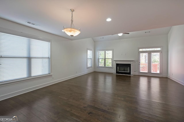 unfurnished living room featuring dark hardwood / wood-style floors and vaulted ceiling