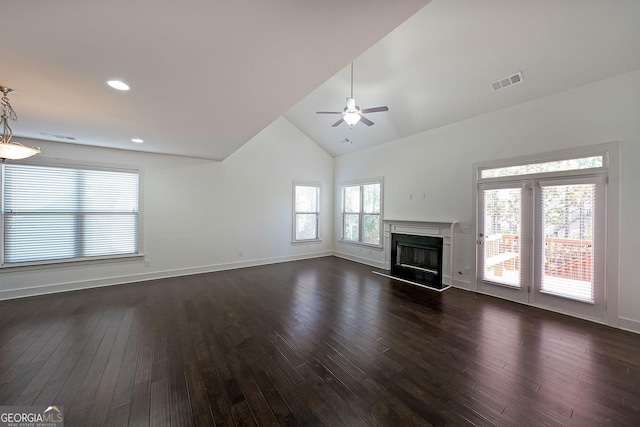 unfurnished living room with lofted ceiling, ceiling fan, and dark hardwood / wood-style floors