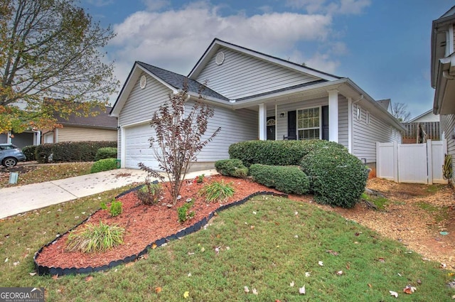 view of front of home with a garage and a front yard