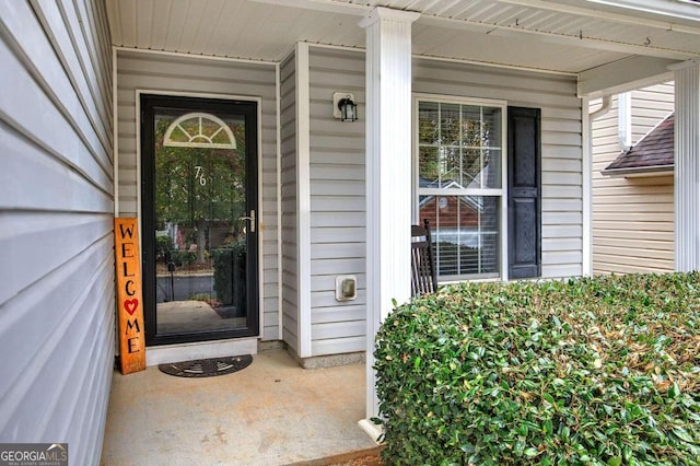 doorway to property featuring a porch