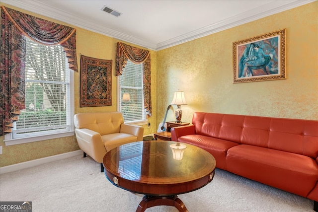 sitting room with carpet floors, plenty of natural light, and ornamental molding