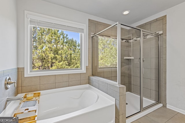 full bathroom with a stall shower, tile patterned flooring, recessed lighting, and a bath