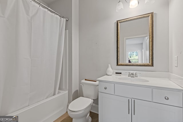 bathroom featuring toilet, shower / bathtub combination with curtain, and vanity