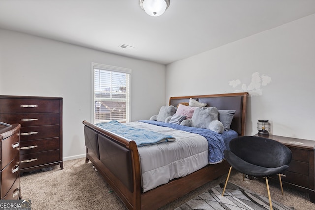 bedroom featuring light carpet, baseboards, and visible vents