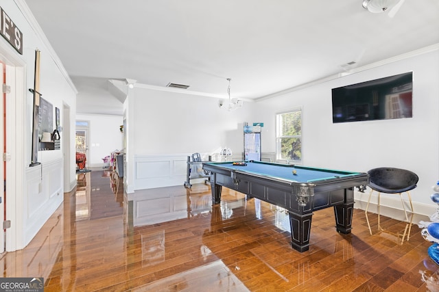 rec room featuring crown molding, pool table, visible vents, a decorative wall, and wainscoting