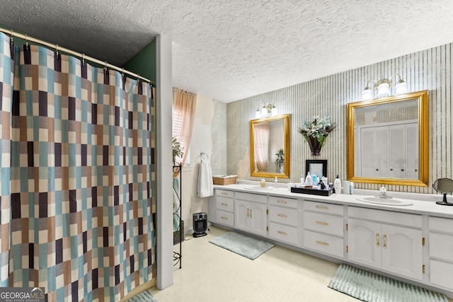 bathroom with vanity and a textured ceiling