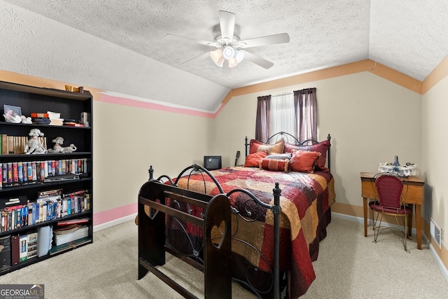 bedroom featuring a textured ceiling, light colored carpet, ceiling fan, and lofted ceiling