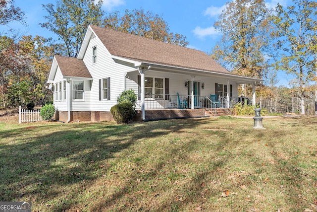 view of front of property with a front lawn and covered porch