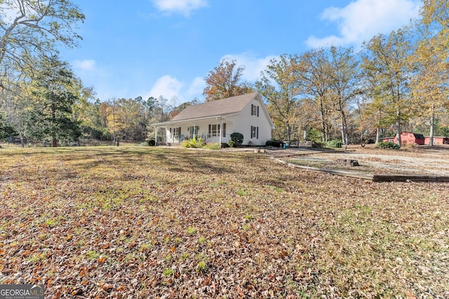 exterior space featuring a yard and a porch