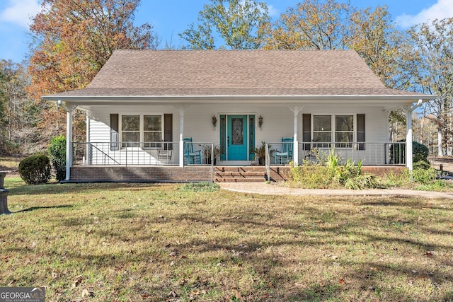 view of front of property with a front yard and a porch