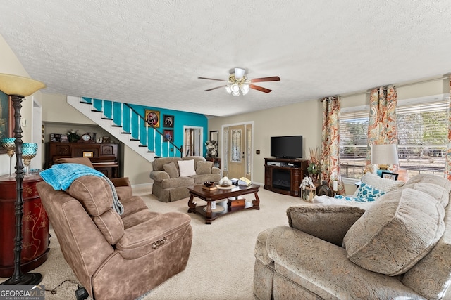 living room with carpet floors and a textured ceiling