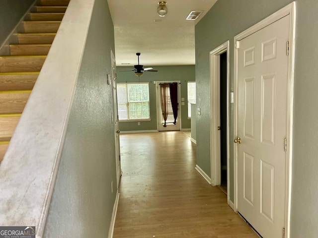 hallway featuring light wood-type flooring