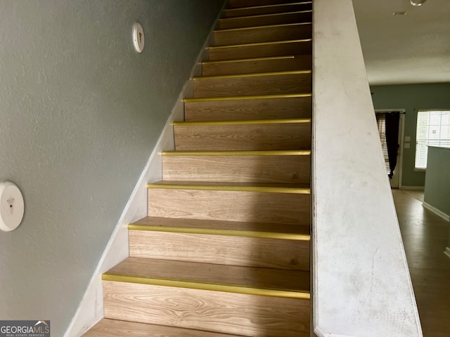 stairway featuring hardwood / wood-style floors