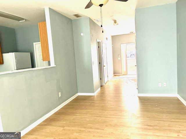 corridor featuring light hardwood / wood-style floors