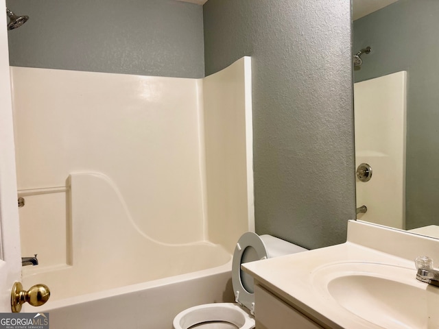 full bathroom with vanity, tub / shower combination, and toilet