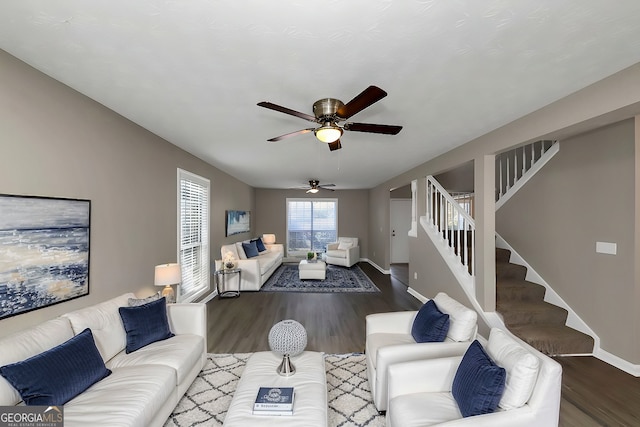 living room with ceiling fan and dark hardwood / wood-style floors