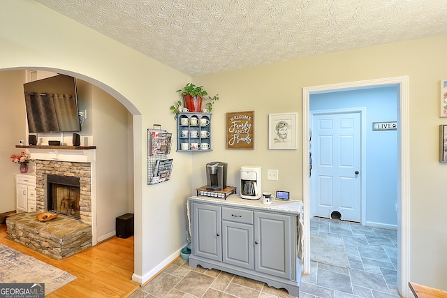 interior space with light hardwood / wood-style floors and a textured ceiling