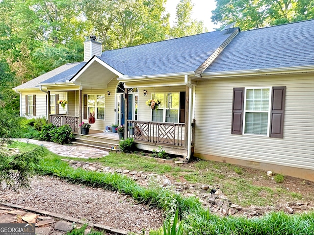 single story home with a porch